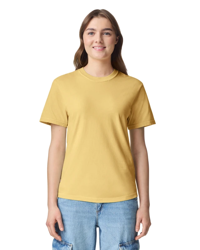 Front view of a woman wearing a yellow short-sleeve T-shirt and light blue jeans against a white background.