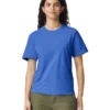 Model wearing a royal blue T-shirt and olive-green pants, standing and smiling at the camera against a white background.
