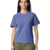 Front-facing woman in a plain blue crew-neck T-shirt and olive-green pants in a studio setting.