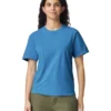 Woman wearing a blue crew-neck T-shirt and olive green shorts, facing forward with a slight smile.