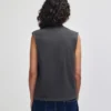 207GD_FadedBlack_03__17458 Person shown from behind wearing a dark gray sleeveless top and blue jeans.