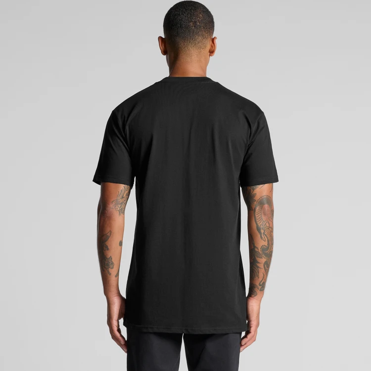 5070_CLASSIC_PLUS_TEE_BACK__28535 Back view of a person wearing a plain black T-shirt, short sleeves, extending past the hips, against a gray background.